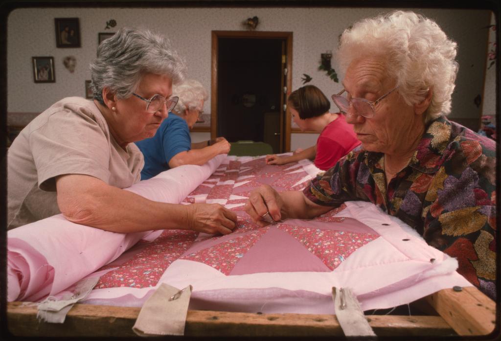 Mabel Brown, Jenny Bonds, Nancy Miller, and Sadie Miller, at their weekly quilting bee in Brown's Hollow, West Virginia. Library of Congress image.